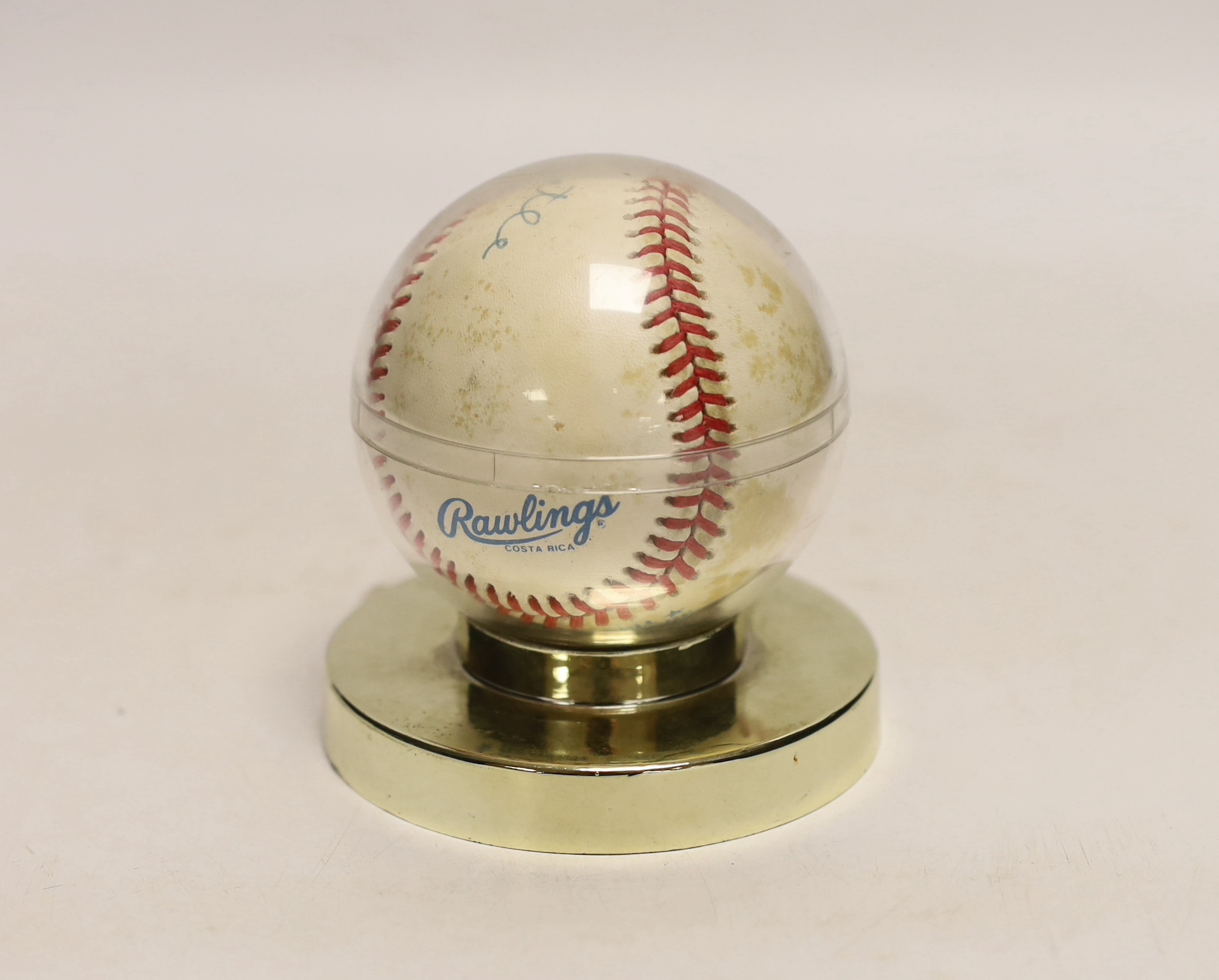A Rawlings Costa Rica baseball autographed by Mickey Mantler, housed in a display case